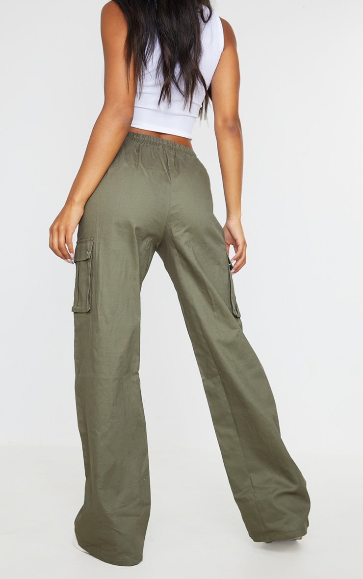 https://cdn-img.prettylittlething.com/b/1/3/6/b13666d903ba7cfae447601616e765aa521fffec_CMO6593_3_khaki_wide_leg_high_waisted_cargo_trousers.jpg